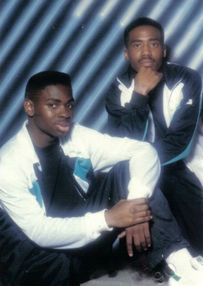 Brothers in sweat suits, looking cool in their brotherly photo